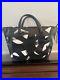 Tumi-Camilla-Sinclair-Black-and-White-Leather-Laptop-Bag-Carry-On-Tote-01-vbbe